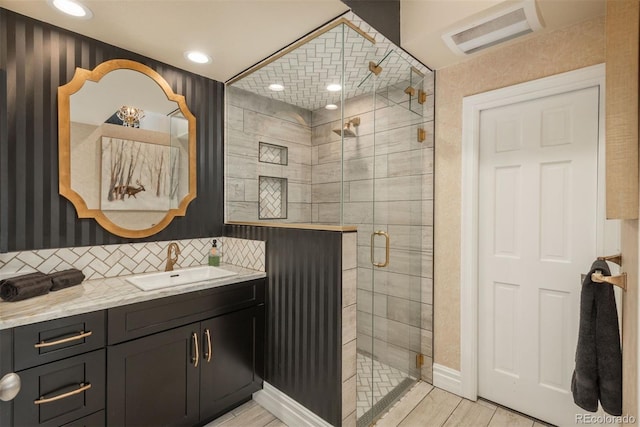 1854 Foothills Dr S, Golden, CO 80401 - full bath with vanity, a stall shower, recessed lighting, visible vents, and decorative backsplash