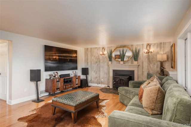 1854 Foothills Dr S, Golden, CO 80401 - living room featuring a fireplace with flush hearth, visible vents, baseboards, and wood finished floors