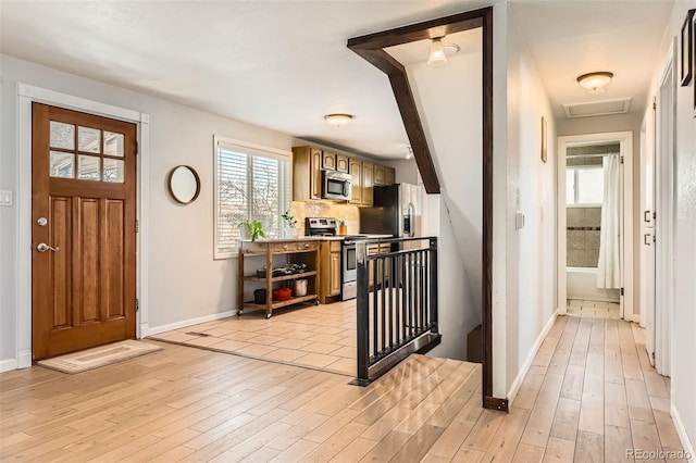 entrance foyer with light hardwood / wood-style flooring