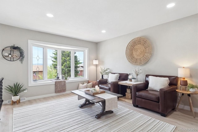 13051 W Jewell Cir, Lakewood, CO 80228 - living room with recessed lighting and light wood finished floors
