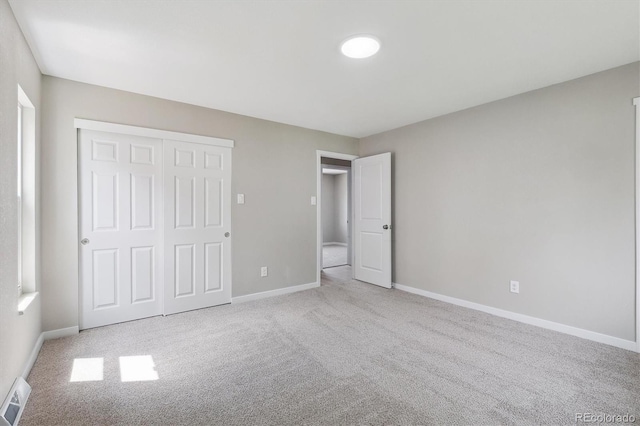 13051 W Jewell Cir, Lakewood, CO 80228 - unfurnished bedroom featuring carpet floors and a closet