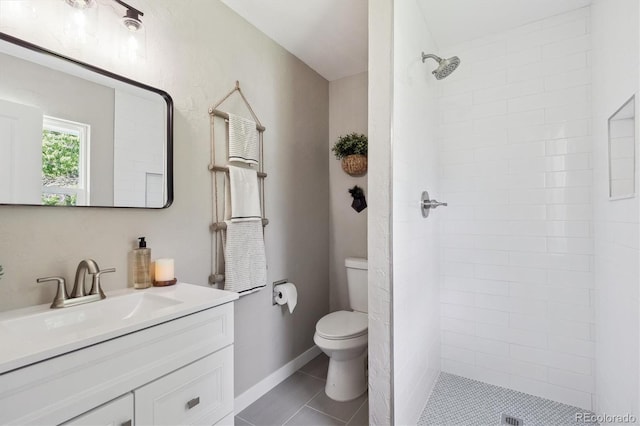 13051 W Jewell Cir, Lakewood, CO 80228 - full bath featuring vanity, tiled shower, and tile patterned flooring