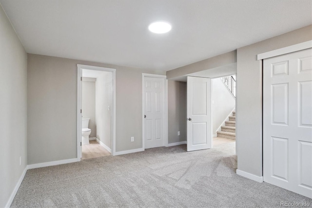 13051 W Jewell Cir, Lakewood, CO 80228 - unfurnished bedroom featuring carpet floors, connected bathroom, and a closet