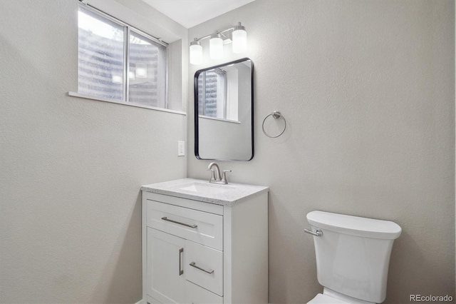 13051 W Jewell Cir, Lakewood, CO 80228 - bathroom with toilet and vanity