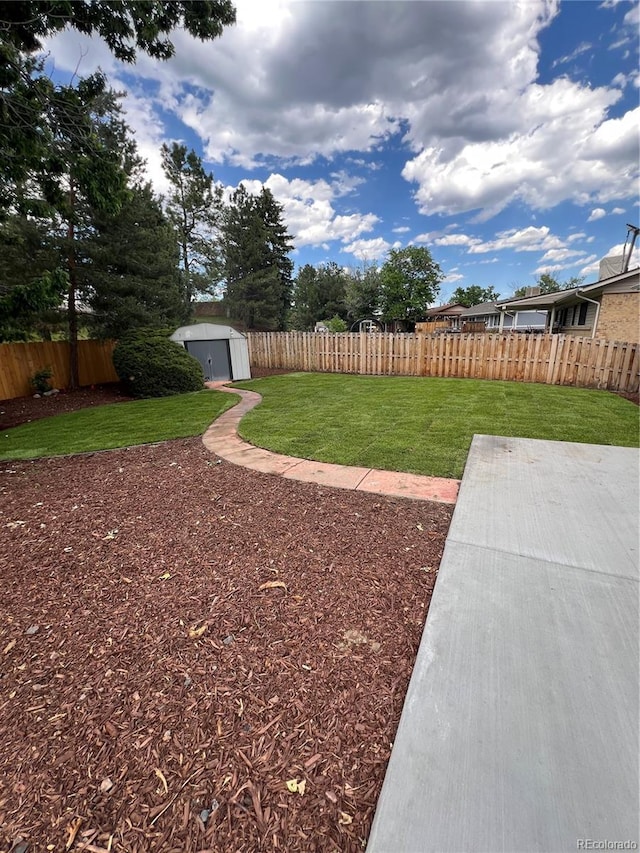 13051 W Jewell Cir, Lakewood, CO 80228 - fenced backyard with a storage unit and a patio