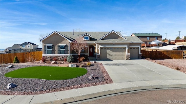 view of front of property featuring a garage and a front yard