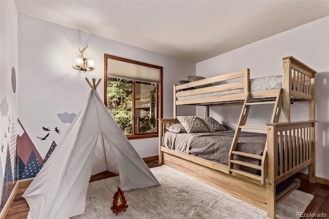 20223 Goins Dr, Morrison, CO 80465 - bedroom featuring baseboards and wood finished floors