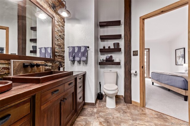 20223 Goins Dr, Morrison, CO 80465 - ensuite bathroom featuring vanity and toilet