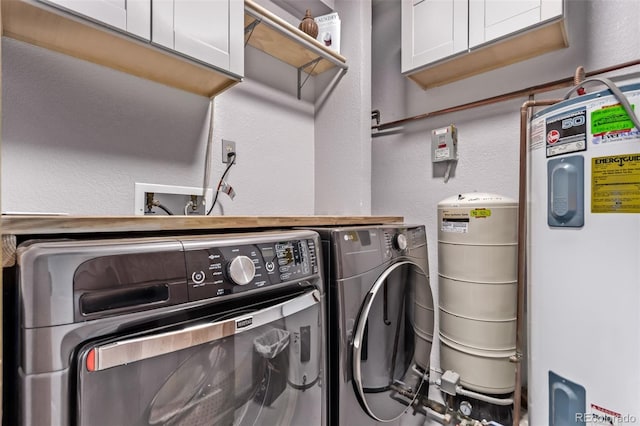 20223 Goins Dr, Morrison, CO 80465 - laundry area with cabinet space, electric water heater, washing machine and dryer, and a textured wall