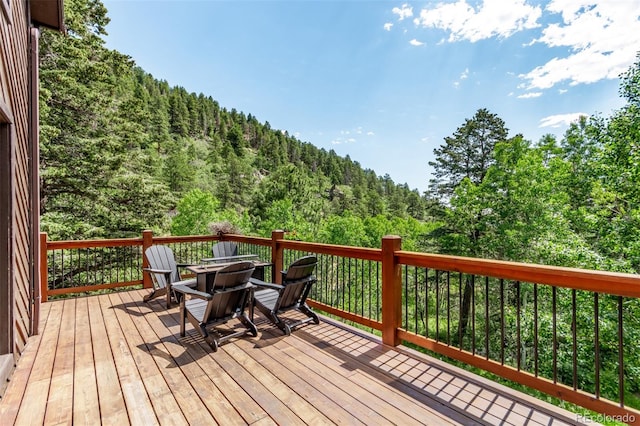 20223 Goins Dr, Morrison, CO 80465 - deck featuring a wooded view