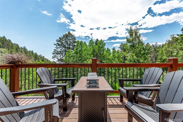 20223 Goins Dr, Morrison, CO 80465 - wooden terrace with an outdoor fire pit