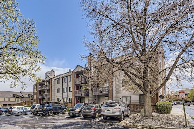 view of property featuring uncovered parking