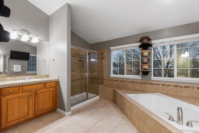 full bathroom featuring tile patterned floors, a shower stall, lofted ceiling, a bath, and vanity