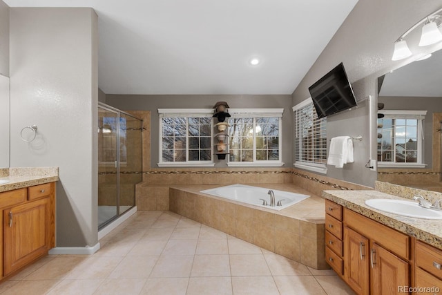 bathroom featuring vanity, tile patterned floors, a garden tub, and a stall shower