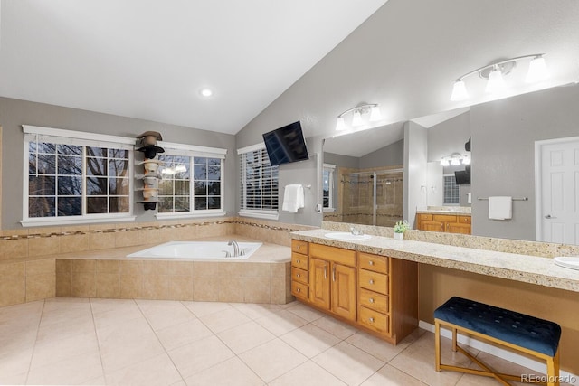 full bathroom featuring lofted ceiling, a stall shower, tile patterned flooring, and a bath