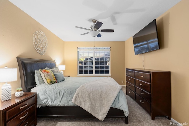 carpeted bedroom with baseboards and ceiling fan