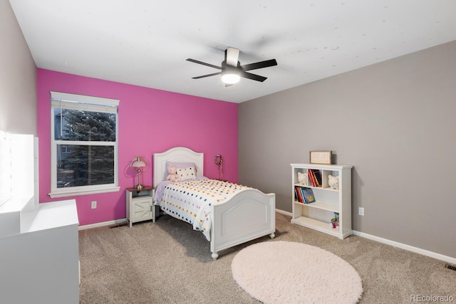 bedroom featuring ceiling fan, visible vents, baseboards, and light carpet