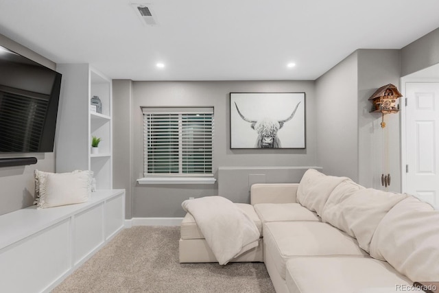 living room with recessed lighting, visible vents, baseboards, and carpet flooring