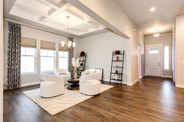 interior space with beamed ceiling, coffered ceiling, an inviting chandelier, and dark hardwood / wood-style flooring