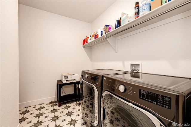 clothes washing area featuring washer and dryer