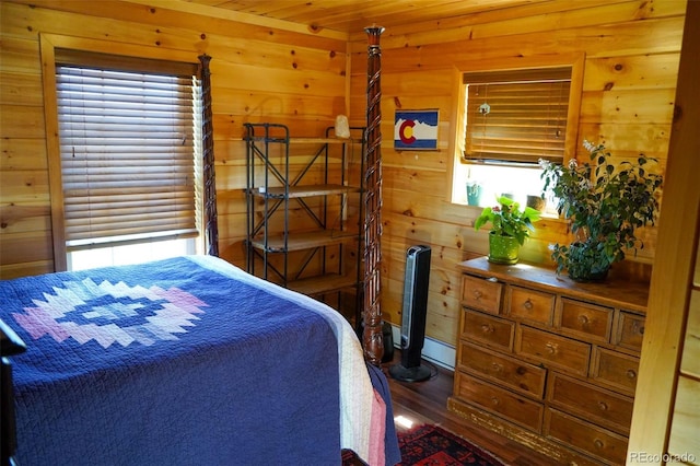 bedroom with dark hardwood / wood-style floors