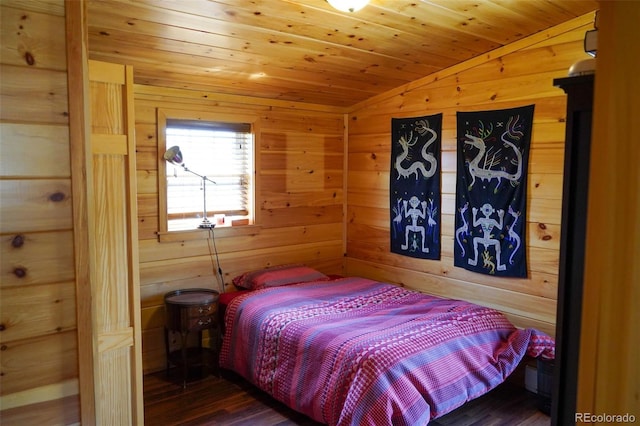 bedroom featuring wooden walls, dark hardwood / wood-style flooring, lofted ceiling, and wooden ceiling