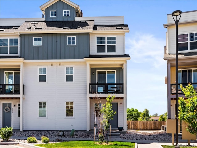 6162 W 28th Ct, Edgewater, CO 80214 - townhome / multi-family property featuring board and batten siding and a balcony