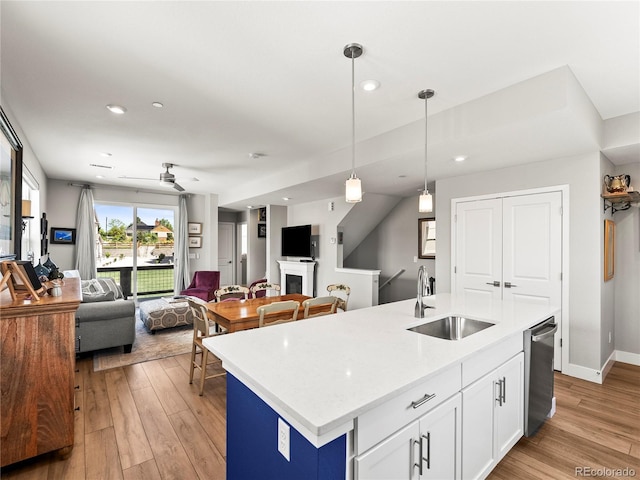6162 W 28th Ct, Edgewater, CO 80214 - kitchen featuring a sink, light wood-style floors, a ceiling fan, open floor plan, and recessed lighting