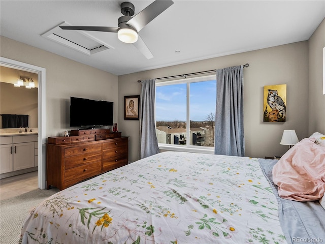6162 W 28th Ct, Edgewater, CO 80214 - bedroom featuring a sink, connected bathroom, a ceiling fan, and light carpet