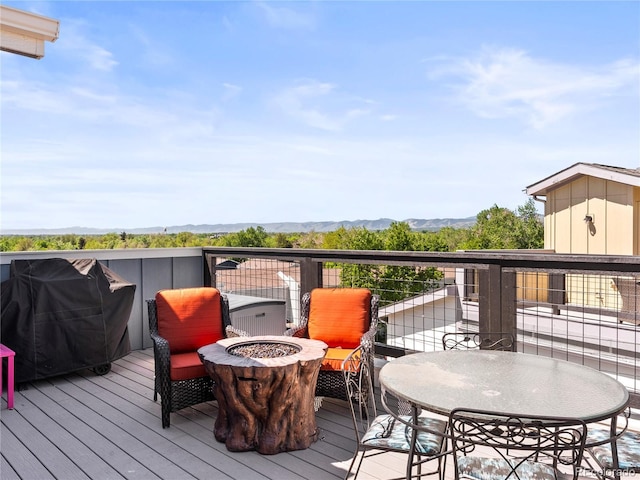 6162 W 28th Ct, Edgewater, CO 80214 - wooden deck featuring a fire pit, a mountain view, and grilling area