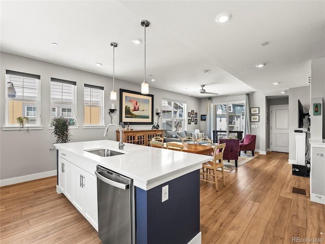 6162 W 28th Ct, Edgewater, CO 80214 - kitchen featuring a sink, dishwasher, light wood-style floors, open floor plan, and recessed lighting