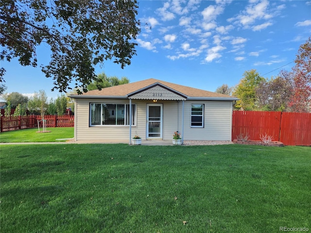 ranch-style house with a front yard