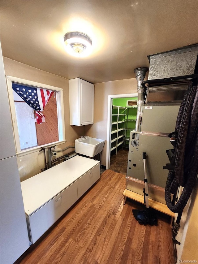 interior space featuring sink and light hardwood / wood-style flooring