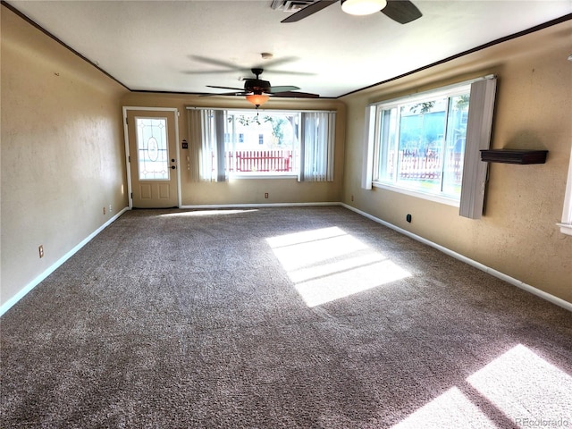 carpeted empty room featuring ceiling fan