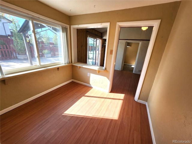 unfurnished room featuring hardwood / wood-style floors