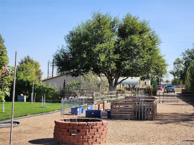 view of home's community with a yard