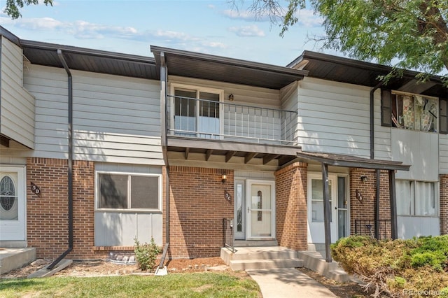 view of property with a balcony