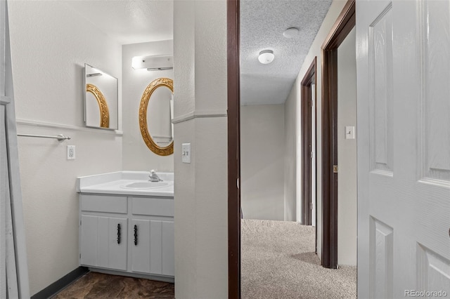 bathroom featuring vanity and a textured ceiling