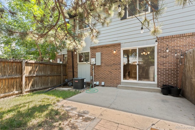 back of house with a patio and cooling unit