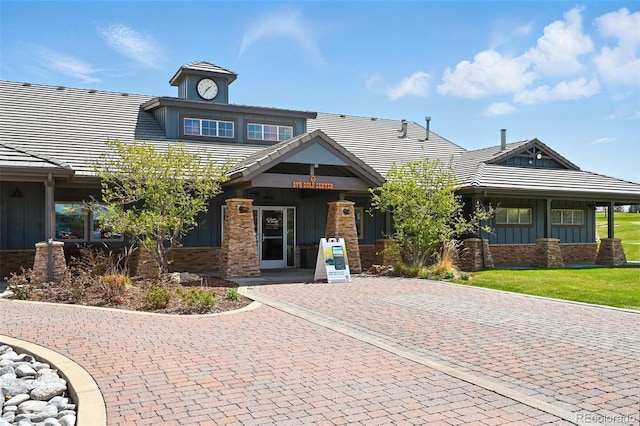 5571 Killarney St, Denver, CO 80249 - craftsman inspired home with board and batten siding and a tile roof