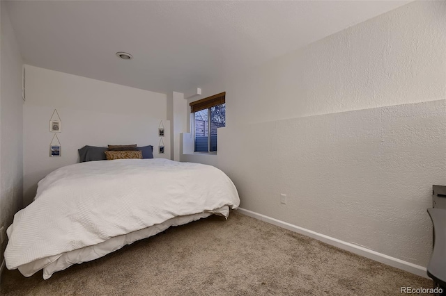 bedroom featuring carpet