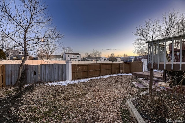 view of yard at dusk