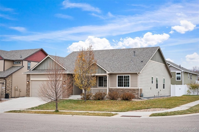 view of front of property featuring a garage and a front yard