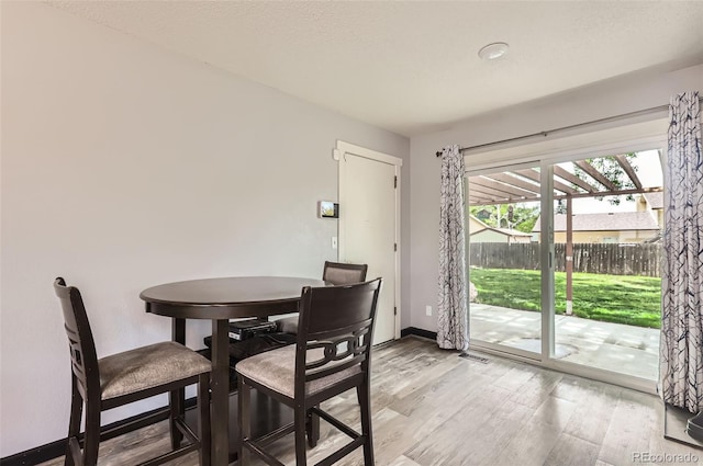 229 Ranae Dr, Loveland, CO 80537 - dining area with light wood-style floors and baseboards