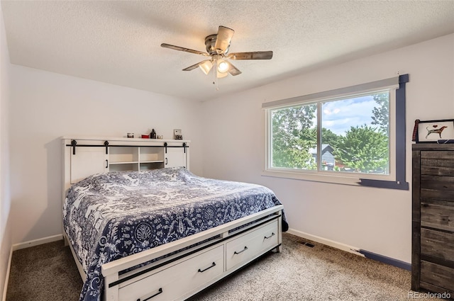 229 Ranae Dr, Loveland, CO 80537 - carpeted bedroom featuring baseboards, ceiling fan, and a textured ceiling
