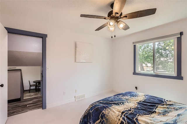 229 Ranae Dr, Loveland, CO 80537 - bedroom with a textured ceiling, baseboards, and a ceiling fan