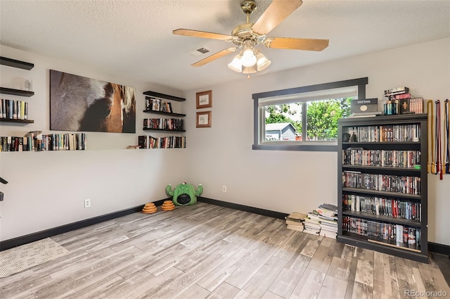 229 Ranae Dr, Loveland, CO 80537 - unfurnished room featuring wood finished floors, ceiling fan, a textured ceiling, and baseboards