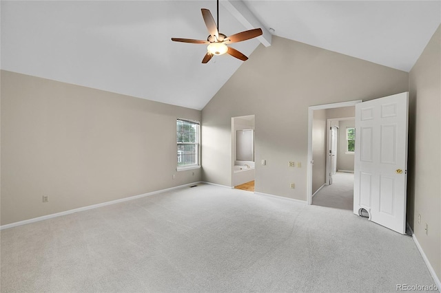 2316 Weatherstone Cir, Highlands Ranch, CO 80126 - unfurnished bedroom with high vaulted ceiling, beam ceiling, multiple windows, light colored carpet, and connected bathroom