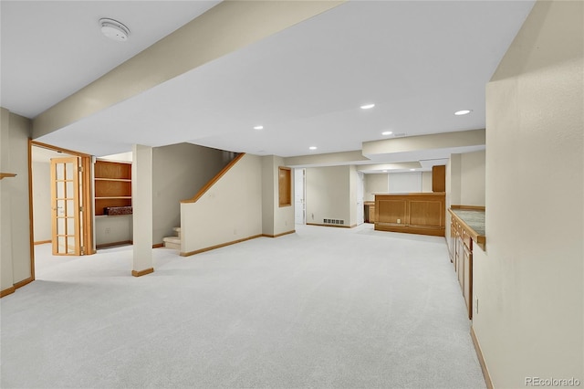 2316 Weatherstone Cir, Highlands Ranch, CO 80126 - finished basement featuring light carpet, stairs, recessed lighting, and bar area