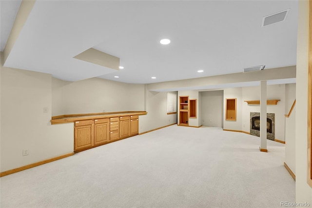 2316 Weatherstone Cir, Highlands Ranch, CO 80126 - finished basement with carpet floors, a glass covered fireplace, and recessed lighting